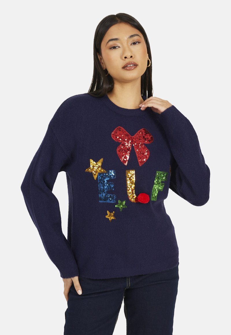 Maglione blu navy con design di paillettes con la parola "ELF", un fiocco rosso e stelle colorate. Realizzato in tessuto morbido con vestibilità comoda.
