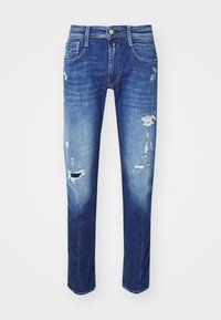 Modré džínové kalhoty s úzkým střihem, zdobené distressed záplatami, s bledým efektem a tradičním pětiokrovým designem.