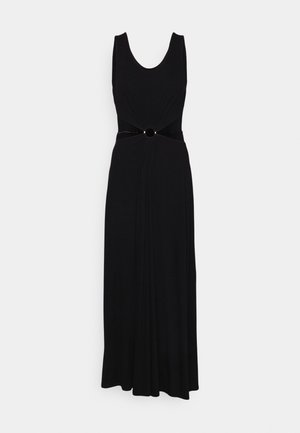 Black sleeveless dress with a scoop neckline, gathered bodice, and a knot detail at the waist accented by a circular black embellishment.