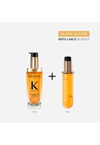 Kérastase Elixir Ultime nachfüllbares Haaröl-Set mit zwei 75 ml transparenten bernsteinfarbenen Flaschen mit schwarzen und goldenen Pumpen.
