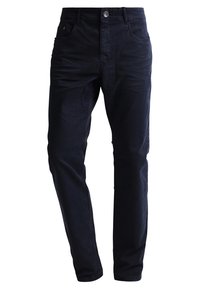 Granatowe dżinsy wykonane z mieszanki bawełny, charakteryzujące się klasycznym pięciokomorowym designem, dopasowanym krojem i metalowym zapięciem na guzik.