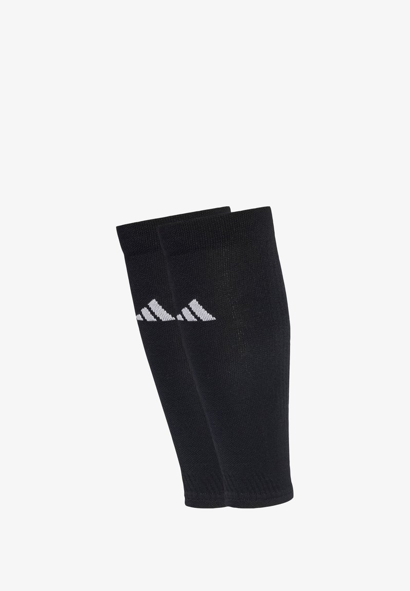 Calze sportive nere con una texture liscia, con un logo Adidas bianco in un motivo diagonale. Realizzate in materiale a maglia elasticizzata.