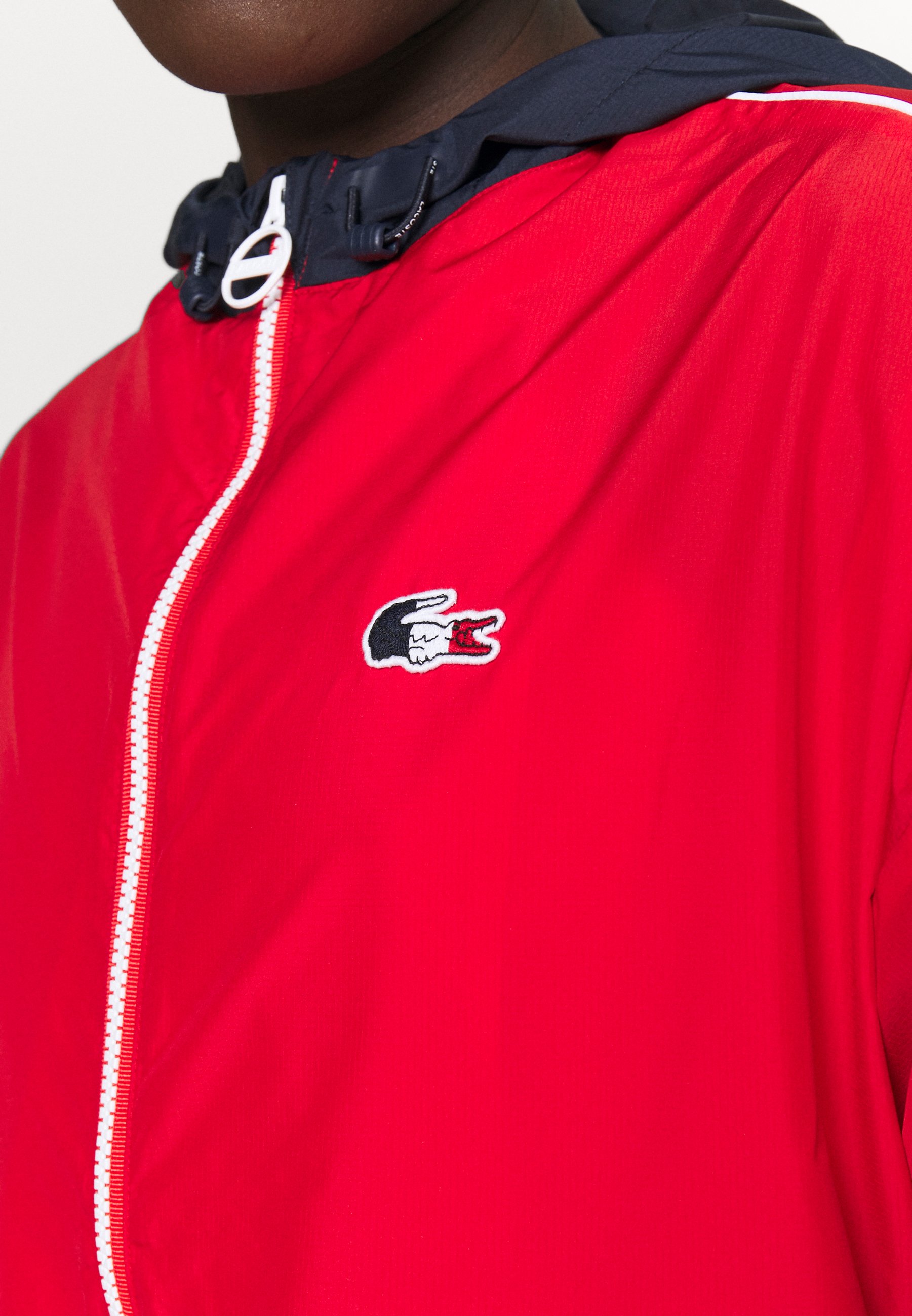 red lacoste windbreaker