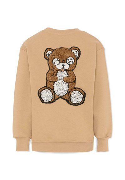 Felpa color sabbia con grafica a orso marrone testurizzato sulla schiena, con occhi rappresentati da bottoni e pancia bianca cucita.