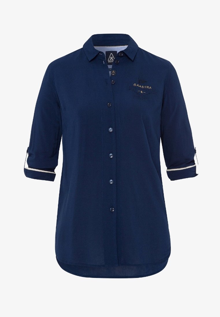 Chemise bleu marine à boutons avec manches retroussées aux trois-quarts et petit logo doré "GAASTRA" sur la poitrine gauche.