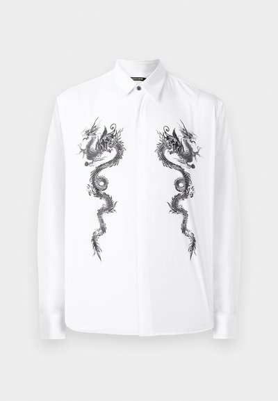 Balta ilga rankovė marškiniai, pagaminti iš lygios medžiagos, su juodais drakono motyvais priekyje. Klassikinis apykaklė ir mygtukų uždarymas.
