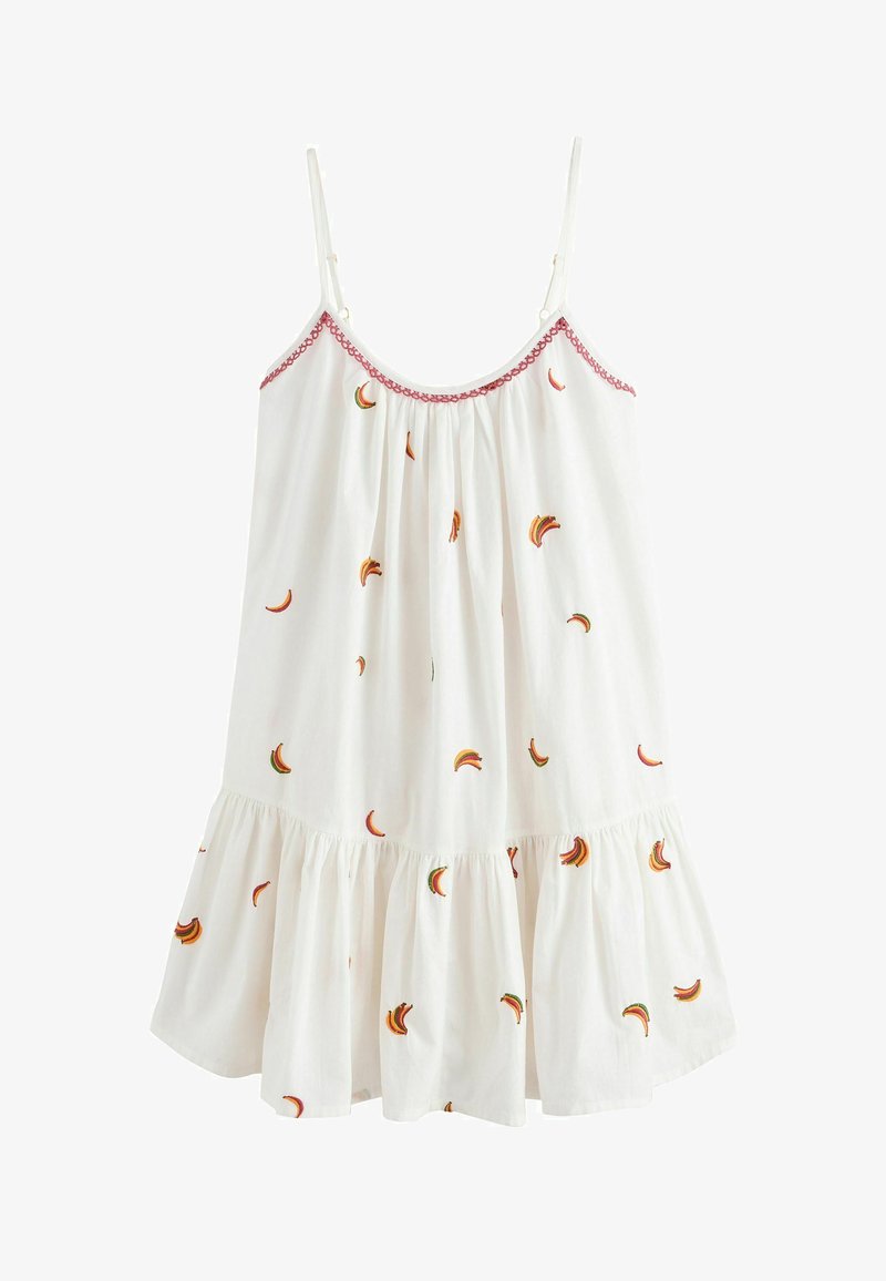 White sleeveless dress with thin straps, pink trim at neckline, and small multicolored banana-shaped embroidery scattered over fabric.
