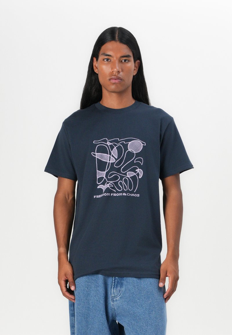 Navy short-sleeve t-shirt made of cotton featuring a pink abstract line design and the text "FREEDOM FROM CHAOS" at the center.
