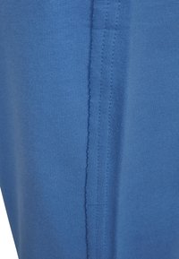 Urban Classics LADIES OPEN EDGE TERRY TURN UP PANTS - Tréningruha alsók - horizonblue