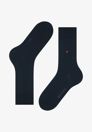 Chaussettes bleu marine en tissu lisse, avec des poignets côtelés, un petit point d'accent rouge et des détails de logo dans une teinte plus claire.