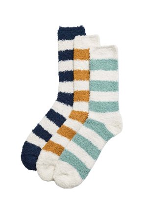 Tres pares de calcetines a rayas: azul marino y blanco, mostaza y blanco, teal y blanco. Textura suave y peluda, longitud hasta la mitad de la pantorrilla, punteras redondeadas.