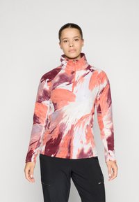 Langarm fleece pullover met kwart-rits in levendige tinten van oranje, paars en wit, met abstracte bloempatronen en een hoge kraag.