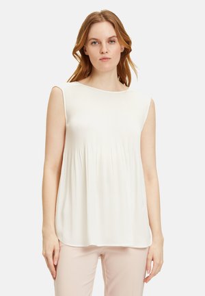 Faltenshirt ohne Ärmel in Off-White. Mit Rundhalsausschnitt und lockerer Passform, aus einem glatten, leichten Stoff gefertigt.