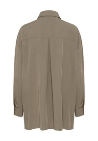 Long-sleeve shirt in light taupe, featuring a collar, back pleat, and buttoned cuffs. Made from a smooth, lightweight fabric.