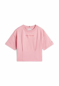 Lyserød cropped t-shirt lavet af bomuld. Har rund hals, korte ærmer og "TOMMY HILFIGER" logo i midten. Glat tekstur.