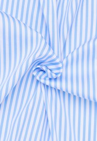 Light blue and white striped fabric, smooth texture, with narrow vertical stripes creating a subtle pattern, folded in a spiraled design.