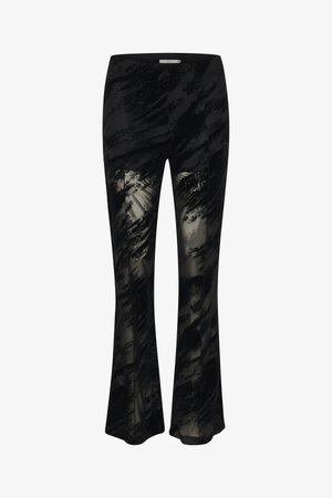 Czarne spódnice dzwony z teksturowaną nakładką, która prezentuje marmurkowy wzór. Posiada przezroczyste panele wzdłuż nóg dla dodatkowego detalu projektu.