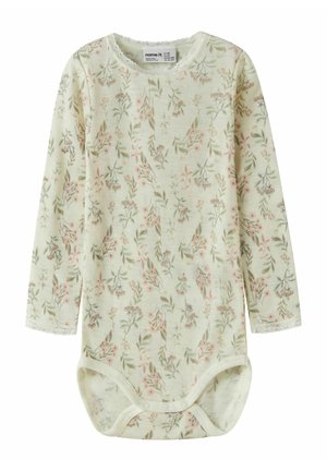 Body en manches longues jaune pâle avec un motif floral rose et vert. Tissu doux, bordure en dentelle autour du col et des manches, fermeture à pression.