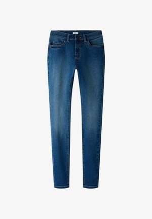 Peenike teksad tumesinisest denimist, millel on sile tekstuur, viis taskut ja kontrastõmblused. Omab lukuga ning vööd hoidvaid silmuseid.