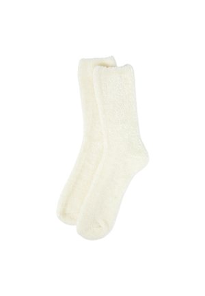 Weiche Elfenbeinsocken aus flauschigem, samtigem Material. Sie haben eine klassische Form mit geripptem Bündchen und keine sichtbaren Muster oder Akzente.