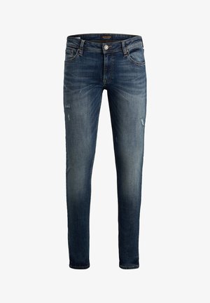 Jean slim en denim bleu foncé avec légère décoloration, légère usure, fermeture à boutons, poches avant et arrière.