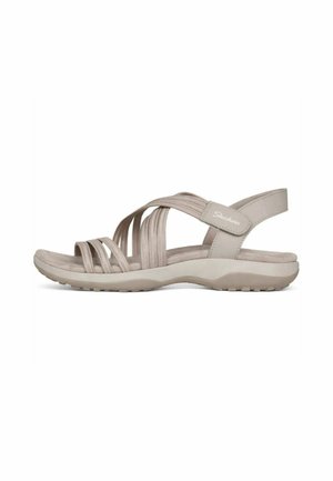 Sandalo beige Skechers con cinturini elastici incrociati, soletta imbottita, cinturino posteriore regolabile e suola testurizzata per una migliore aderenza.