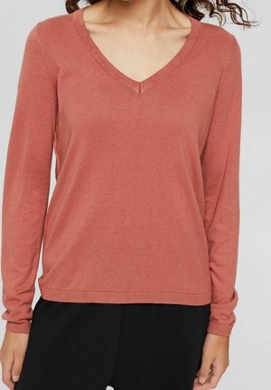 Langarm-Pullover mit V-Ausschnitt in verwittertem Rosé, aus einem weichen Strickmaterial gefertigt, zeichnet sich durch eine lockere Passform und dezente Rippeneinsätze an den Ärmeln und am Saum aus.