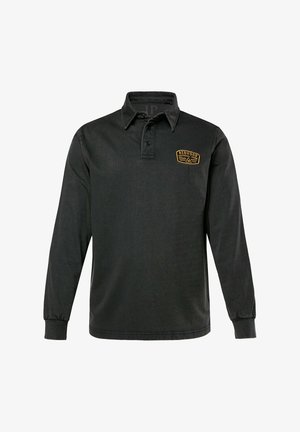 Polo a maniche lunghe nera realizzata in tessuto testurizzato, con patta dei bottoni e logo giallo ricamato sul petto.