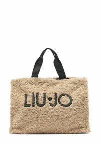 Borsa beige in tessuto plush con superficie texturizzata, caratterizzata da un logo nero "LIU·JO" sul davanti e doppi manici neri.