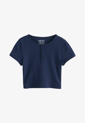 Top corto azul marino de manga corta con escote redondo y cuatro botones frontales, hecho de tela texturizada.