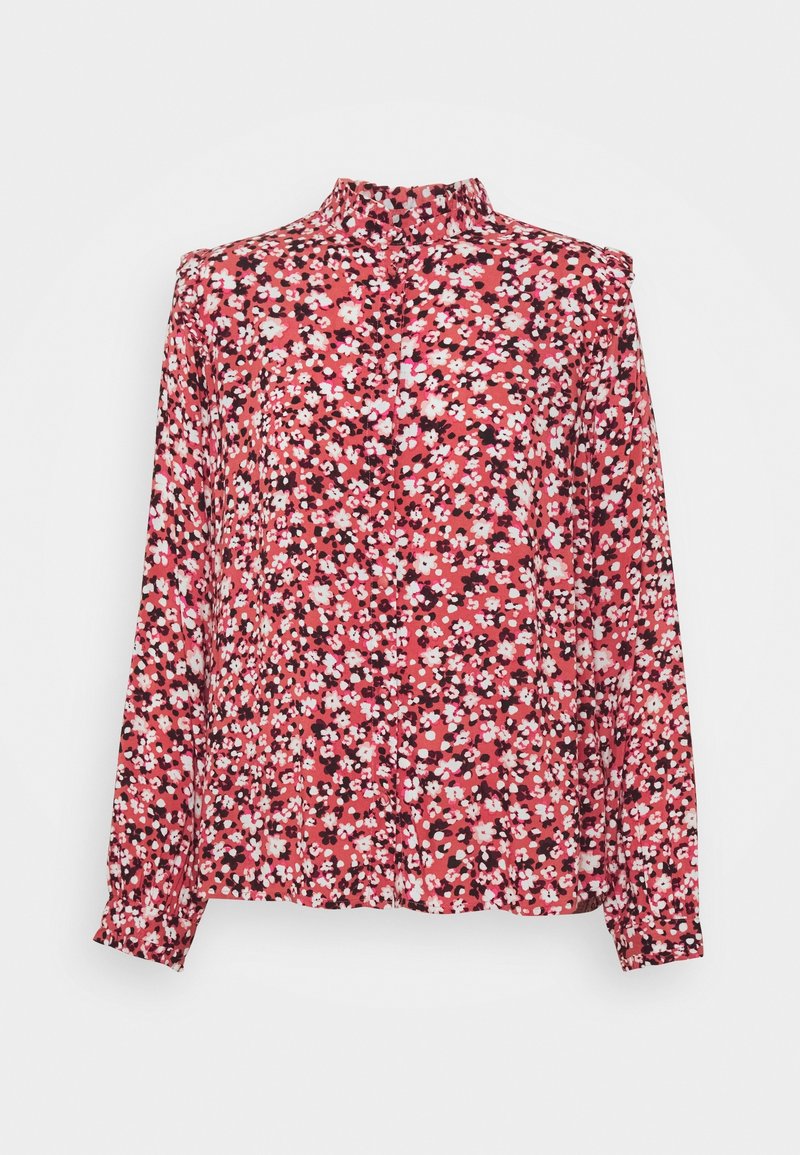Blouse à manches longues avec petit motif floral rose, blanc et noir sur fond rouge et col montant.