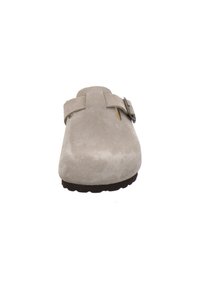 Beige suede clog with a single buckle strap, rounded toe, and textured surface; black rubber sole for grip.