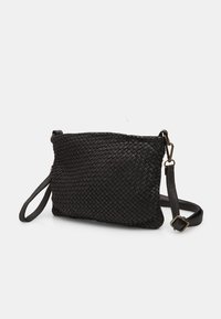 Black woven clutch bag made of textured leather, featuring a detachable strap and a zip closure. Compact rectangular shape.