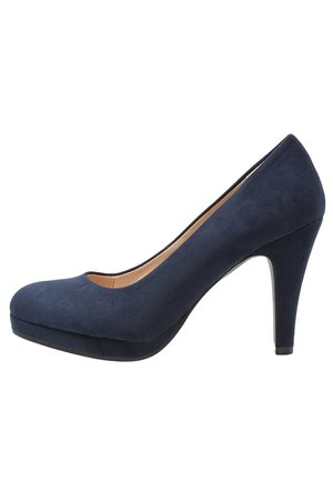 Navy blue suede high-heeled women's shoe with a rounded toe and platform sole, photographed against a white background.