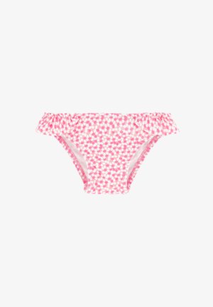 Braguitas de bikini rosa con lunares blancos con detalles de volantes en los laterales sobre un fondo blanco.