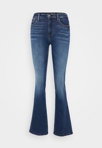 guess jeans a zampa