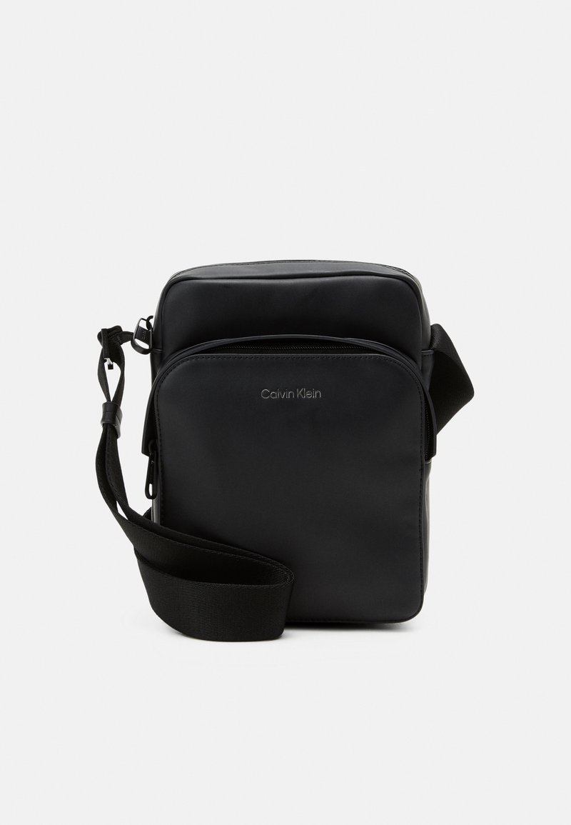 Calvin Klein MUST REPORTER UNISEX - Cross body bag - ck black
