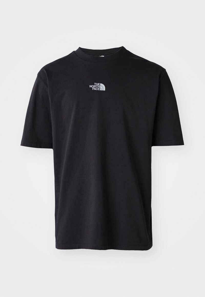Camiseta de algodón negra de manga corta, con cuello redondo y pequeño logo plateado en la parte superior izquierda del pecho. Textura suave, corte relajado.