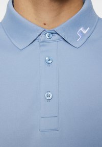 J.LINDEBERG Sports TOUR - Pikeepaita - rain washed