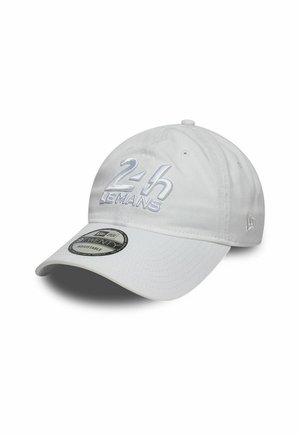 White baseball cap with embroidered "24h Le Mans" text, adjustable strap, and a curved brim. Features visible stitching and ventilation holes.