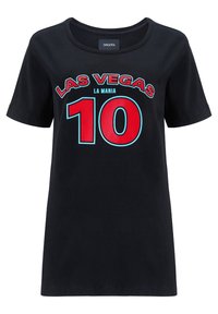 Black cotton t-shirt with short sleeves featuring a bold red and blue graphic print stating "LAS VEGAS LA MANIA 10" on the front.