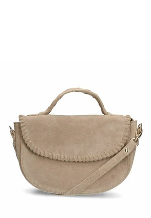 Beige suede handbag with a curved shape, fringed flap closure, top handle, and an adjustable shoulder strap. Smooth texture with minimal hardware.