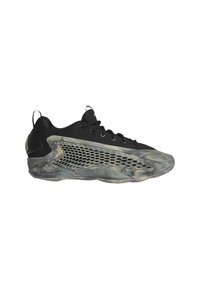 Scarpe sportive nere con una tomaia in rete, un tallone nero testurizzato e una suola semi-trasparente con motivi grigi a vortice e dettagli intagliati.