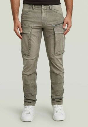 Cargo-Hosen aus hellgrauem Stoff, ausgestattet mit mehreren Seitentaschen, einer Reißverschlusstasche und einer schlanken Passform mit leicht tailliertem Bein.