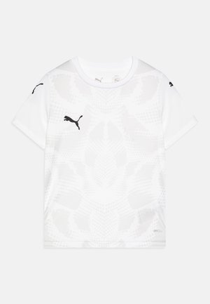 Valge lühikese varrukaga spordipolt, millel on peen tekstuuripattern. Särgil on mustad logoaktsendid varrukatel ja ees. Valmistatud niiskuse juhtimise materjalist.