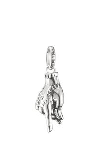 Silver pendant shaped like a hand with intricate detailing, featuring stitched accents and a loop marked "WEDNESDAY."