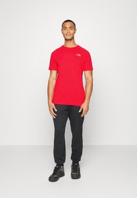 The North Face TEE - T-shirt estampada - horizon red