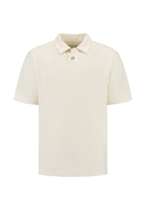 Kreemivärvi polo särk tekstureeritud kangaga, lühikeste varrukatega ja kolme nööbiga kaelusega. Lihtne disain, ilma mustrite ja aksessuaarideta.