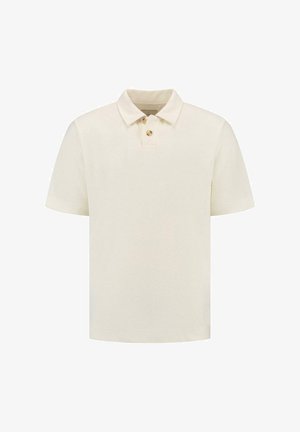 Kreemivärvi polo särk tekstureeritud kangaga, lühikeste varrukatega ja kolme nööbiga kaelusega. Lihtne disain, ilma mustrite ja aksessuaarideta.