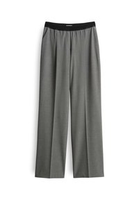 Pantaloni larghi grigi con vita elastica nera e tasche laterali, esposti piatti su uno sfondo bianco.